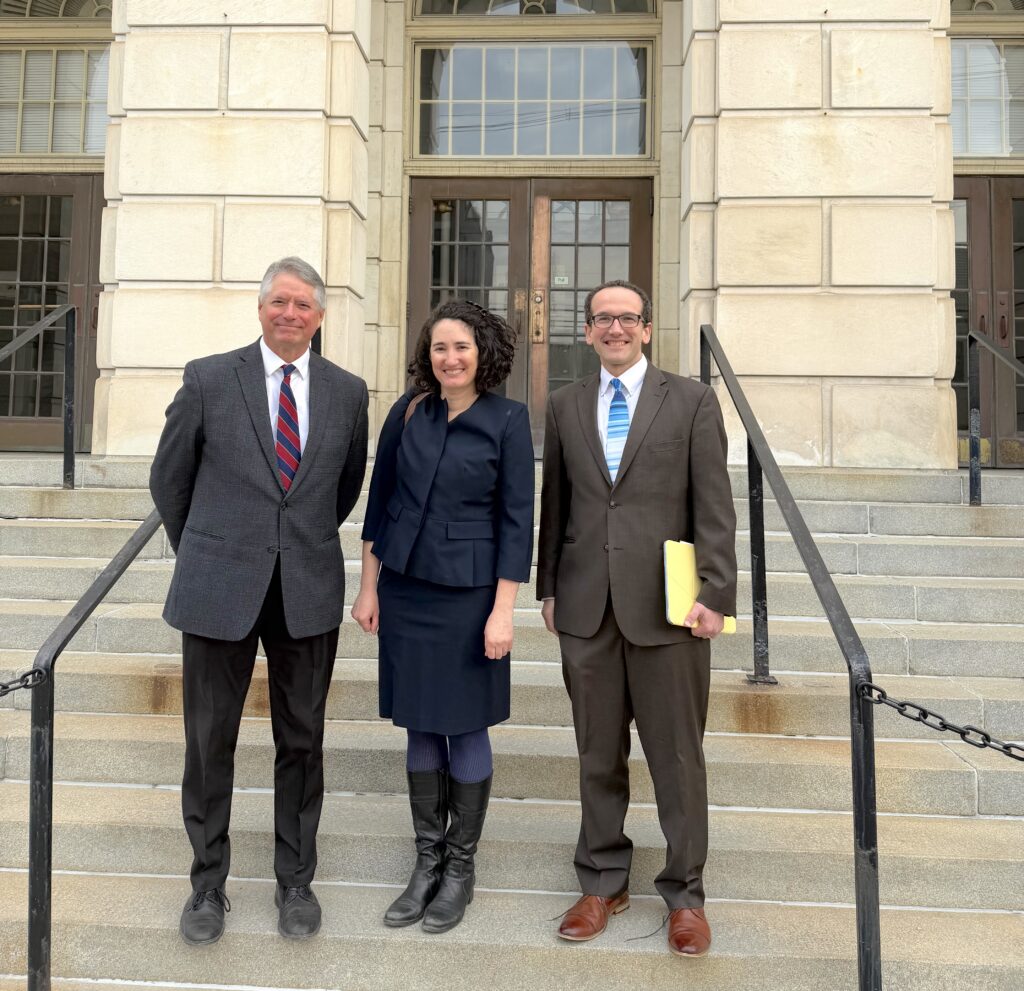 Photo: VPIRG’s Paul Burns is joined in front of the federal courthouse in Rutland by Jenny Rushlow of CLF and Christophe Courchesne of Vermont Law and Graduate School.  